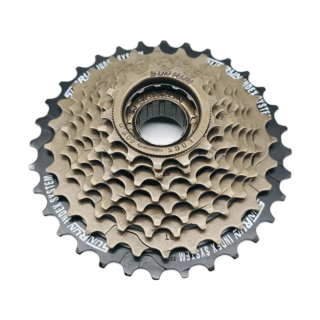 What effect does the design of an indexed flywheel have on the speed and efficiency of a mountain bike?
